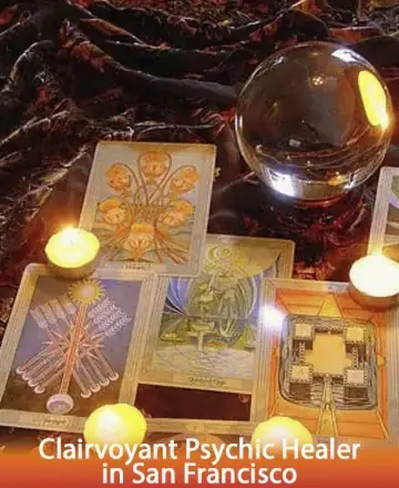 In a serene space filled with gentle candlelight, tarot cards unfold stories of wisdom and guidance, while a crystal ball reflects the mysteries of the universe. This tranquil setting invites peace and introspection. Clairvoyant psychic healer in San Francisco.