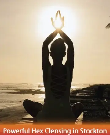 In the gentle embrace of a setting sun, a serene figure finds tranquility by the water's edge, hands gracefully reaching towards the light. This moment of peace invites a deep sense of calm and reflection. Powerful hex cleansing in Stockton.