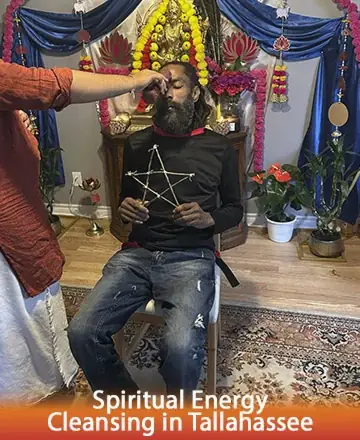 In a serene space filled with vibrant colors and sacred symbols, a gentle touch offers profound peace, guiding the spirit toward clarity and harmony. The atmosphere is rich with warmth, inviting a deep sense of trust and connection. Spiritual energy cleansing in Tallahassee.
