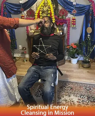 In the serene embrace of a sacred space, gentle hands offer a soothing touch, inviting peace and renewal. Surrounded by vibrant colors and spiritual harmony, one finds solace and profound connection. This moment of deep tranquility nurtures the soul. Spiritual healing in Mission.