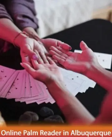 In an atmosphere of warmth and serenity, gentle hands connect over a table adorned with cards, inviting a journey of self-discovery and inner peace. The soft glow fosters a sense of trust and wisdom, guiding you to embrace your path. Online palm reader in Albuquerque.