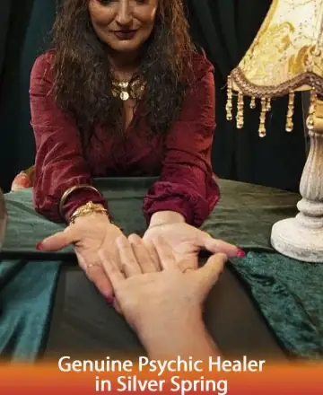 In the serene glow of a warmly lit room, a compassionate psychic healer gently cradles a hand, offering solace and understanding. Her eyes, filled with wisdom, guide those seeking clarity and peace. Experience the gentle embrace of genuine spiritual connection. Spiritual guidance in Silver Spring.