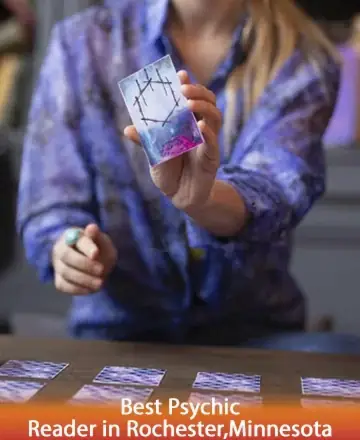 In a serene moment of reflection, a gentle hand reveals a card imbued with mysteries of the universe. Clad in soothing hues, the setting invites peace and introspection, offering guidance and clarity through the art of tarot. Psychic readings in Rochester, Minnesota.