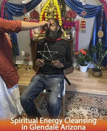 In a serene and sacred space adorned with vibrant flowers and calming colors, a gentle ritual unfolds. A kind hand imparts soothing energy, enveloping the soul in peace and balance. This moment of tranquility invites deep renewal and harmony. Spiritual energy cleansing in Glendale Arizona.