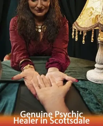 In a serene sanctuary of warmth and wisdom, a gentle soul offers her hands to guide you on a journey of inner peace and clarity. The soft glow of the lamp whispers comfort as you explore hidden truths. Genuine psychic healer in Scottsdale.