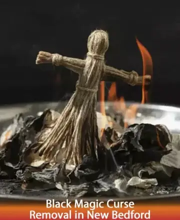 In the gentle glow of a sacred ritual, a simple straw figure stands amidst soft, flickering flames. This serene scene invites a sense of release and renewal, as whispers of ancient wisdom guide the way. Black magic curse removal in New Bedford.