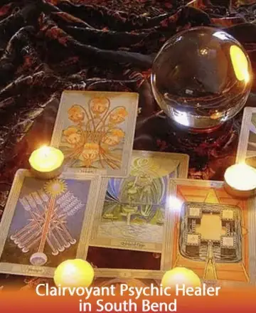 In a serene haven, golden candles cast a gentle glow upon intricate tarot cards, inviting soulful reflection and peace. The crystal ball, shimmering softly, whispers of ancient wisdom and guidance, offering solace to the seeker. Clairvoyant psychic healer in South Bend.