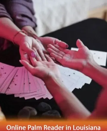 In the gentle glow of serene light, two hands meet over a spread of cards, inviting a moment of introspection and peace. The warmth in their touch speaks of trust and a journey towards understanding. Online palm reader in Louisiana.