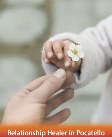 A gentle touch speaks volumes, as a tender hand offers a delicate blossom, symbolizing hope and renewal. This moment captures the essence of trust and connection, inviting warmth and peace into your heart. Relationship healer in Pocatello.