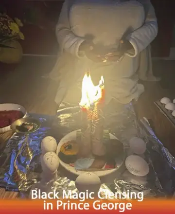 In a tranquil setting bathed in the soft glow of candlelight, gentle hands hold sacred objects, inviting peace and renewal. Surrounded by symbols of protection and harmony, the atmosphere hums with positive energy, offering solace and clarity. Black magic cleansing in Prince George.