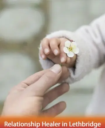 In the gentle exchange of a delicate blossom, we find the beauty of connection and the warmth of shared moments. This tender interaction speaks of trust and the simple joys of life’s journey. Relationship healer in Lethbridge.
