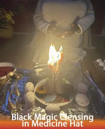 In a serene setting, the gentle glow of candlelight illuminates a sacred space, where tranquility and healing converge. Surrounded by symbols of protection and peace, the atmosphere invites you to release burdens and embrace inner harmony. Black magic cleansing in Medicine Hat.