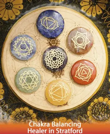 This image radiates serenity and balance, showcasing seven beautifully crafted stones, each symbolizing a unique chakra. The intricate patterns and warm hues invite a sense of harmony and tranquility, offering a gentle embrace to your spirit. Chakra balancing healer in Stratford.