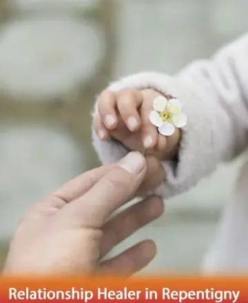 In a serene moment of connection, the gentle touch of two hands sharing a delicate blossom speaks volumes of trust and unity. This image evokes a sense of warmth and tranquility, guiding hearts towards healing and understanding. Relationship healer in Repentigny.